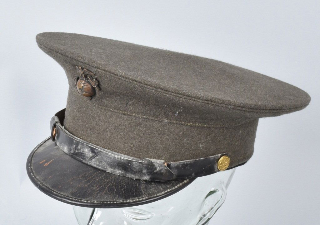 U.S. MARINE CORPS OFFICER'S HAT: Wool hat made by The MC Marine Cap, full liner and sweat band, general wear to brim, with insignia. Very Good