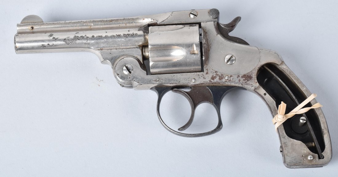 SMITH & WESSON.32 REVOLVER, AMERICAN EXPRESS: SN *454390, back strap engraved Am. Ex. Co. 1499, 1/4" barrel with very good bore, old re-nickel, retains about 90% finish, missing one hard rubber grip. Action tight,. Very Good *