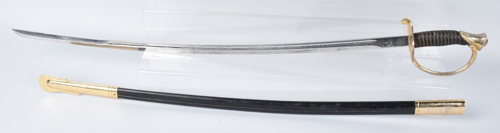 U.S.M.C. OFFICERS SWORD and LEATHER SCABBARD: 32" bright etched blade, marked Zubco Boston Stainless, Taiwan. tight hilt, nice leather wrap and wire, has wear to gold on hit and mounts. Very Good plus