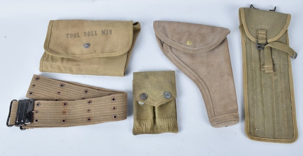 LOT OF WW1 and WW2 CANAVS US MILITARY ITEMS: Lot includes M15 cleaning kit marked Bearse 1943, a canvas .45 holster, a WW! Mills mag pouch, a M10 Tool Roll and a web belt. Very Good