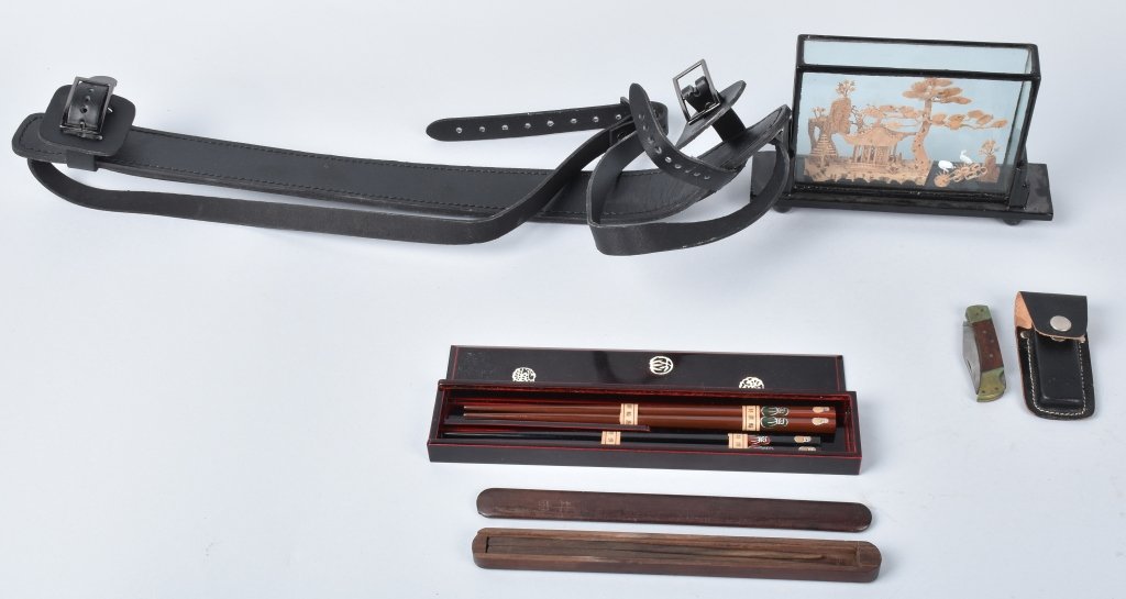 JAPANESE CHOP STICKS, SWORD STRAP and MORE: Lot includes WW2 vet souvenir chop sticks, pair of chop sticks in lacquered box, pocket knife, a wonderful sawn wood diorama under glass, and a leather sword strap. Excellent