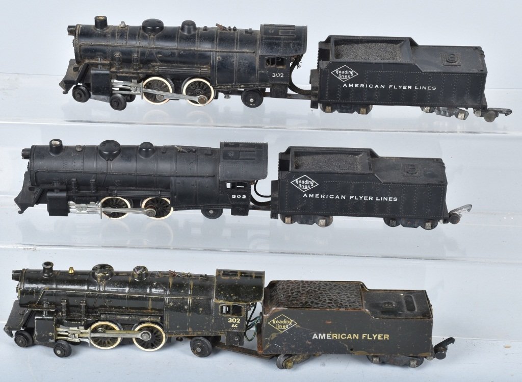 AMERICAN FLYER LOT OF LOCOMOTIVES and TENDERS: Lot includes tin late No. 302, along with 2 diecast No. 302 locomotives, untested. Condition varies.