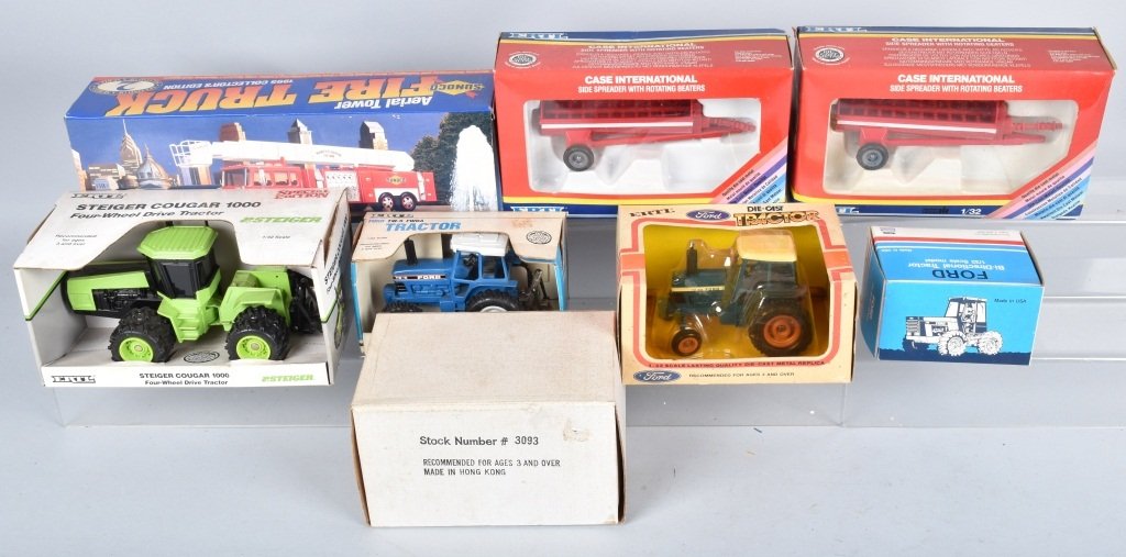 LOT OF 5 TRACTORS FIRE TRUCK & 2 SIDE SPREADERS: Flat of various tractors including Ford, Steiger, Case Side Spreaders and collectable Sunoco collectable Fire Truck