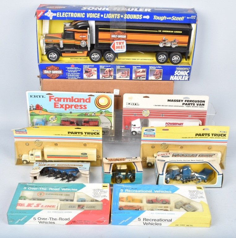 LOT OF 11 DIFFERENT TRUCKS & TRACTORS: Lot of 11 different trucks and tractors , Harley Semi Castrol GTX semi, Ford tractors and others. All new in box