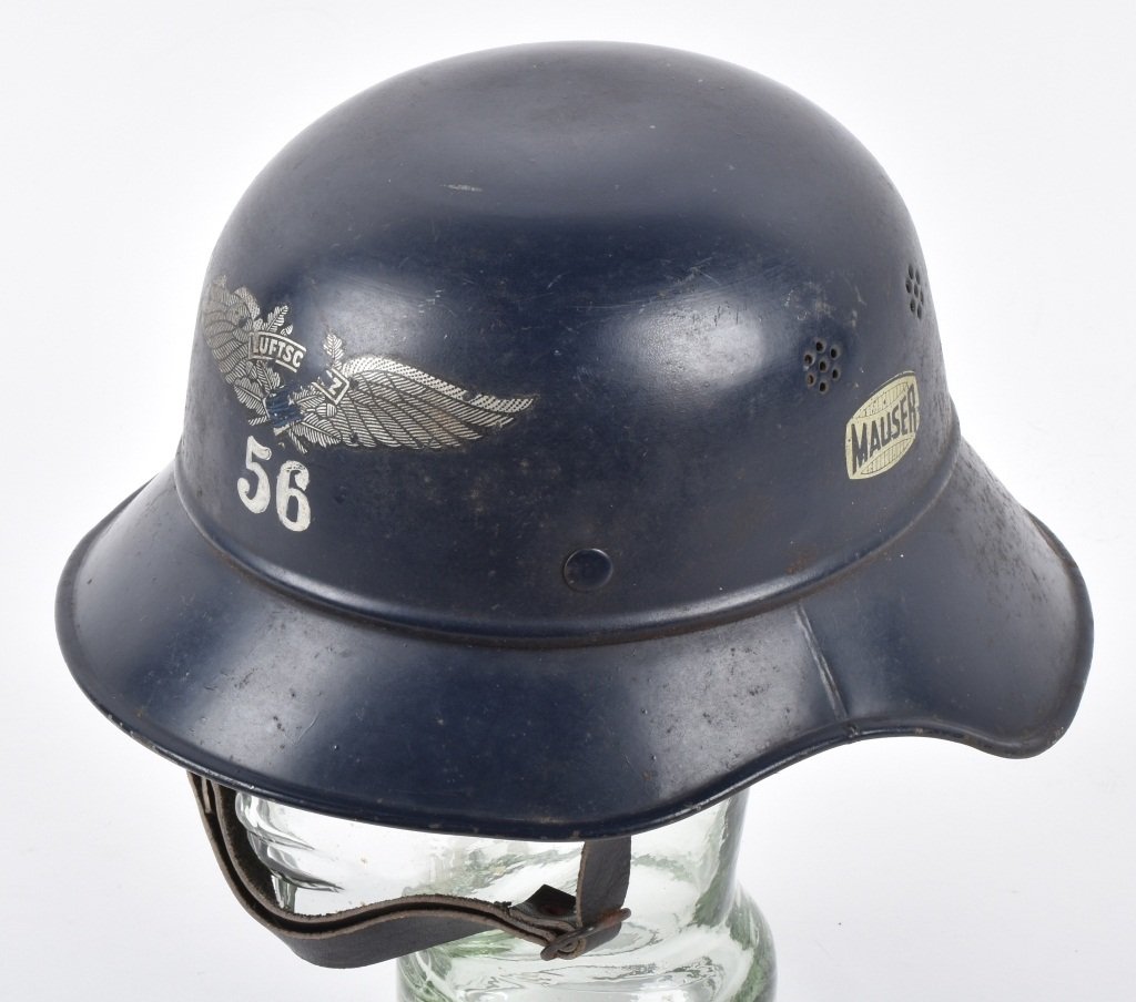 WWII GERMAN MAUSER FACTORY GUARD HELMET: Nice original helmet. Has decent decals on the helmet. Helmet is numbered 56 and has the name Hild painted inside it. Has original decals inside helmet. Leather liner is present with chin strap. Nice 