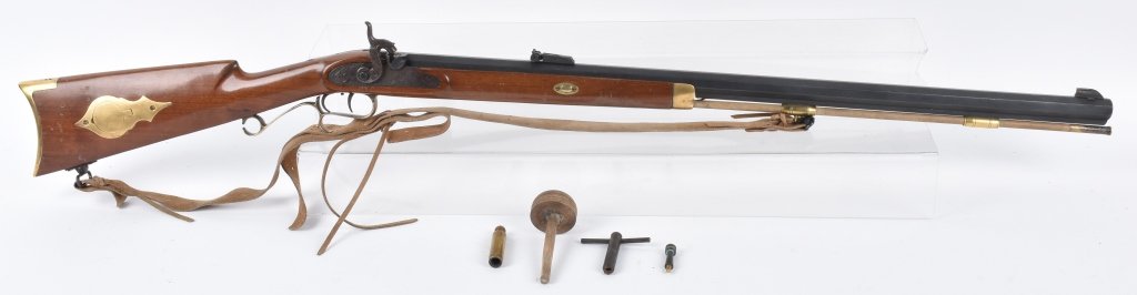 THOMPSON PERCUSSION .50 HAWKEN RIFLE: SN 2846, 32" barrel, well made gun by Thompson Center Arms, with set triggers, nice action, stocks and finish. Has leather sling. Minor wear., includes nipple wrench and other tools. Excellent