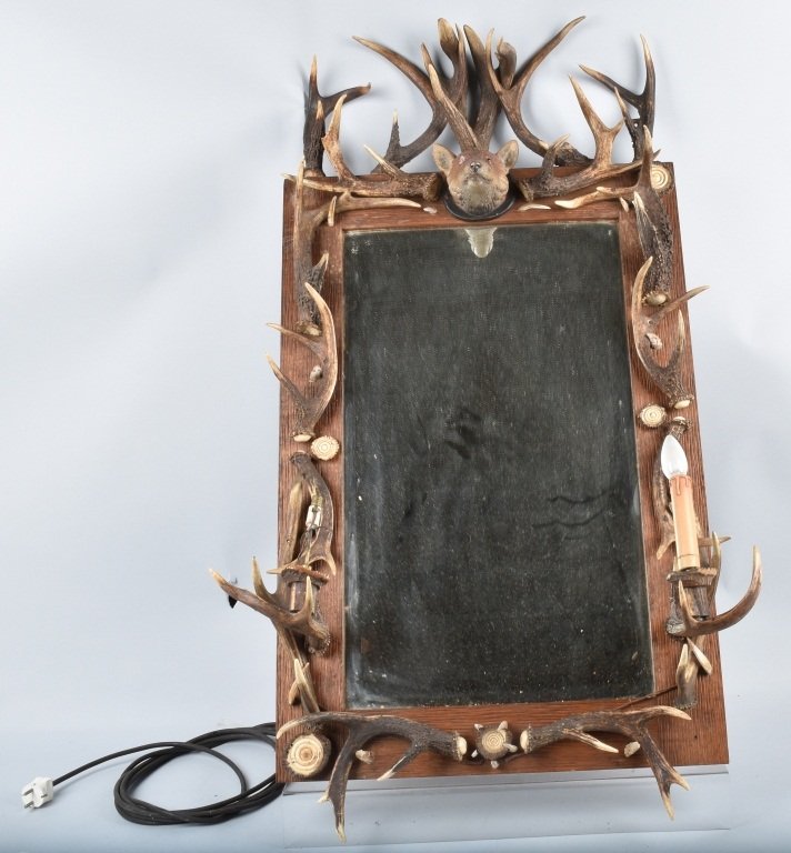 1920s GERMAN RED STAG ANTLER WALL MIRROR: Excellent 1920s Wall Mirror made of wood and decorated with Red Stag and other Antlers. Mirror is al original condition. Has 2 electric sockets for light bulbs. Has period ceramic Wolfs Head in top ce