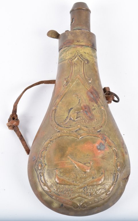 BRASS POWDER FLASK with HUNTING SCENES: 7 3/4" high, has panels with dog and quail, good seams, some denting, missing spring and one loop. Good-Very Good