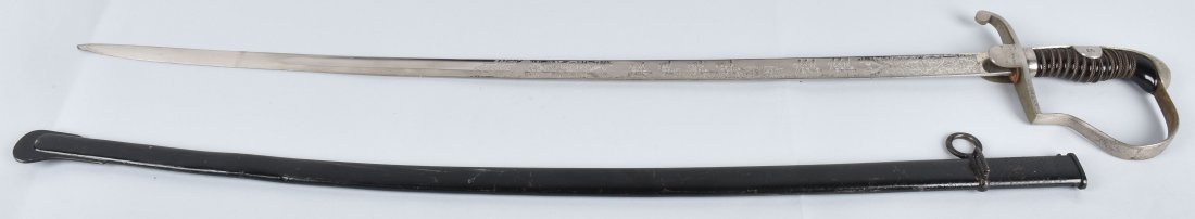 IMPERIAL GERMAN ARTILLERY OFFICER'S SWORD: 36" overall with a 30" blade, Very nice sword with a mirror etched blade. One side is marked Preub. Art Regt. 6 . 1. Batt., and the other is beautifully etched with soldiers horses and a cannon and ca
