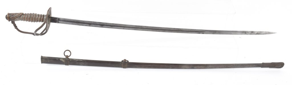 M1872 US CAVALRY OFFICER'S SWORD and SCABBARD: 36" overall with 31" blade that has a patina salt and pepper finish. Nice cast brass hilt, grip missing wrap and wire. Scabbard is solid and has some original finish. Very Good