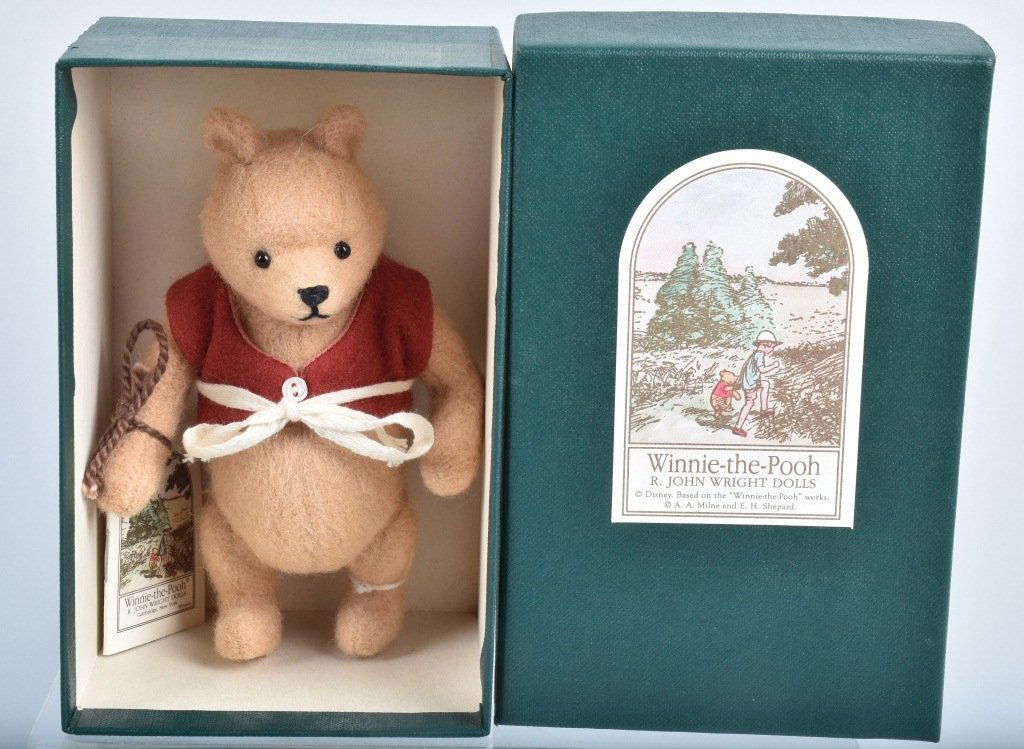 R. JOHN WRIGHT WINNIE THE POOH POCKET POOH NMIB: R. John Wright Winnie the Pooh Pocket Pooh. Pooh is 5 inches made of mohair plush and is fully jointed. Date of Release: 1993. Ltd Ed 002411/3500. He has his paper pamphlet attached NMIB*