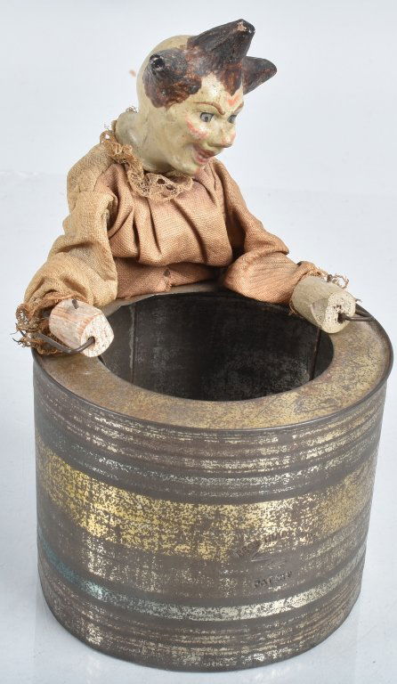 Early GERMAN CLOWN DRUMMER JAR TOPPER: Very early German Clown Drummer made to go over a can or jar. Head is ceramic. Drum is tin. Great early colors and look. A very unusual item. 7" Excellent