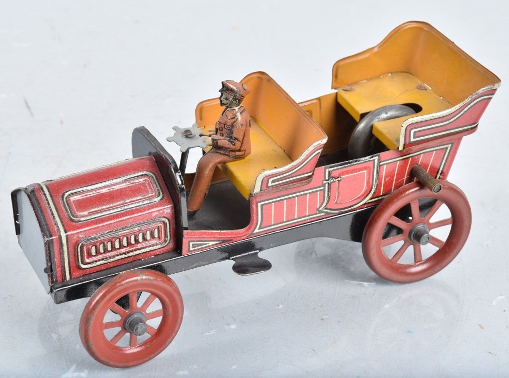 CARETTE Tin Flywheel OPEN CAR w/ DRIVER (1 of 5)