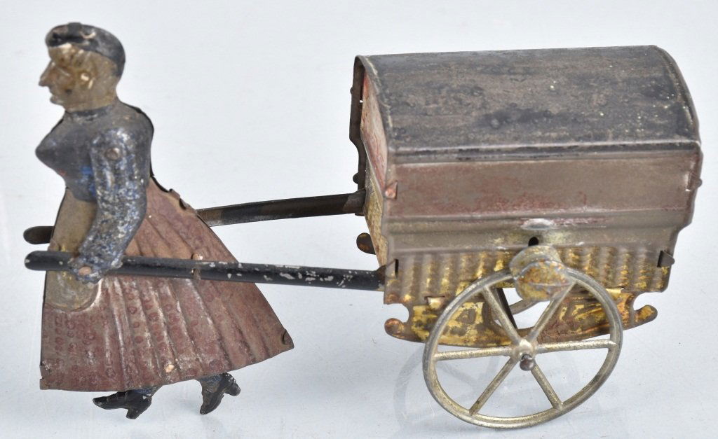 FRENCH Tin Flywheel LADY PULLING CART (1 of 4)