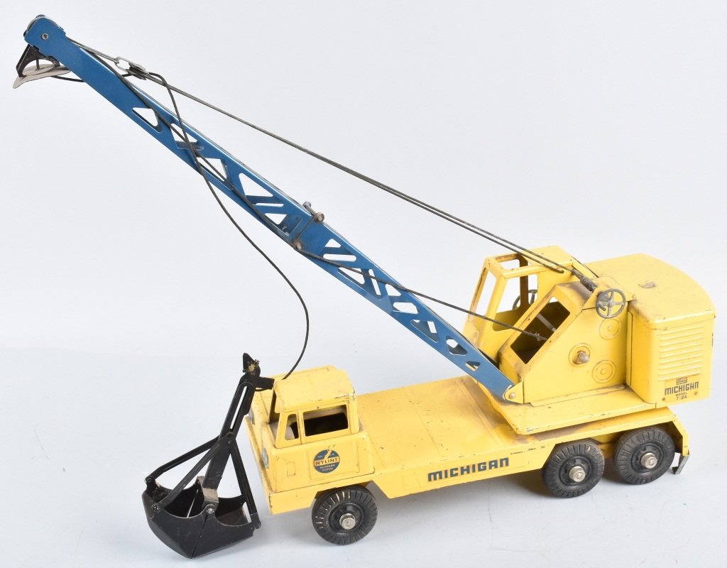 NYLINT Pressed Steel MICHIGAN CRANE TRUCK: All original with nice paint. Still has bucket. May clean to higher grade. 18" Very Good-Excelent