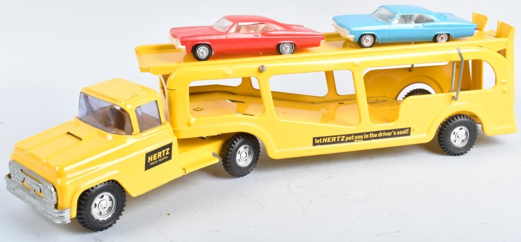 BUDDY L HERTZ CAR HAULER: Nice restored Car Hauler with Hertz Logos. Nice Paint. Comes with 2 Cars. 27" Excellent