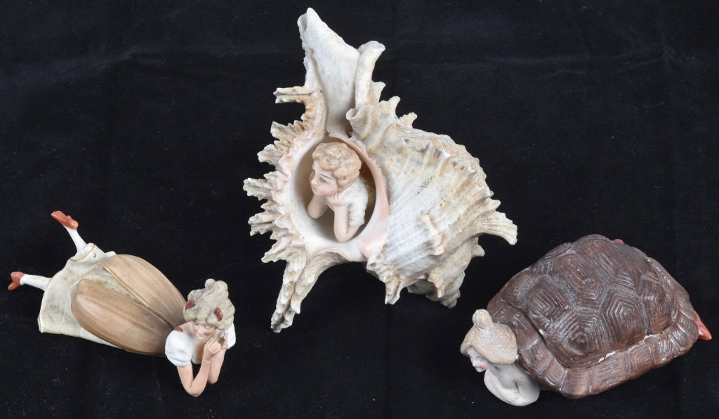 3-GERMAN BISQUE FIGURES: Largest is 5". nice lot with nude in turtle shell, reclining girl, and reclining figure in sea shell. Light soiling. Excellent