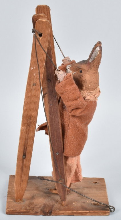 EARLY GERMAN GERMAN RABBIT on LADDER: 8 1/2" high, move the leaver and the composition rabbit flips over the ladder. Very Good