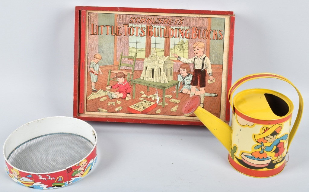 OHIO ART TIN BEACH ITEMS, & SCHOENHUT BLOCK BOX: Lot includes tin Ohio Art beach pail with original price tag, and sifter, along with 1927 Schoenhut empty block wood box. All three have minor wear. Great graphics on the Schoenhut box lid. Excellent.