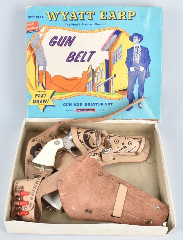 ESQUIRE WYATT EARP GUN BELT, BOXED: Nice set in the original colorful box, guns appear to be lightly used, worked when tested, there are some corrosion spots on cylinders from the holsters. Colorful box is nice with light wear. Excellen