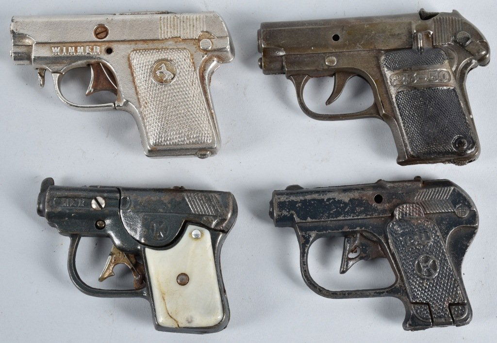 4-CAST IRON CAP GUNS: Lot includes Pal, Rex, Winner and 25-50. Largest is 4 1/2", all worked when tested. Very Good