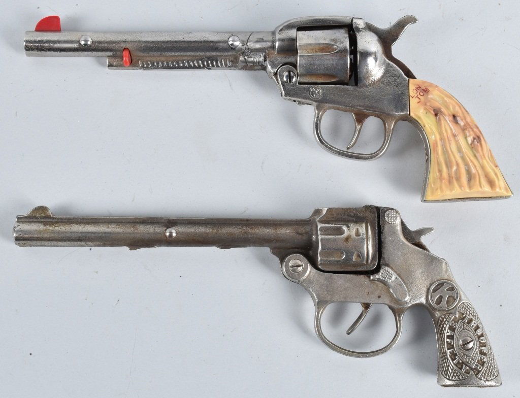 2-CAST IRON LONG BARREL CAP GUNS: Lot includes Long Tom and Trooper. Largest is 10 1/4", Both worked when tested. Long Tom has repair on barrel. Very Good