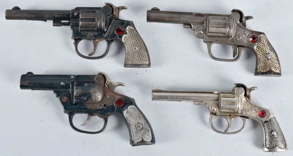 4-CAST IRON CAP GUNS with JEWELS: Lot includes Dixie, Texas, Westo and Sliko. Largest is 7", All worked when tested. Very Good