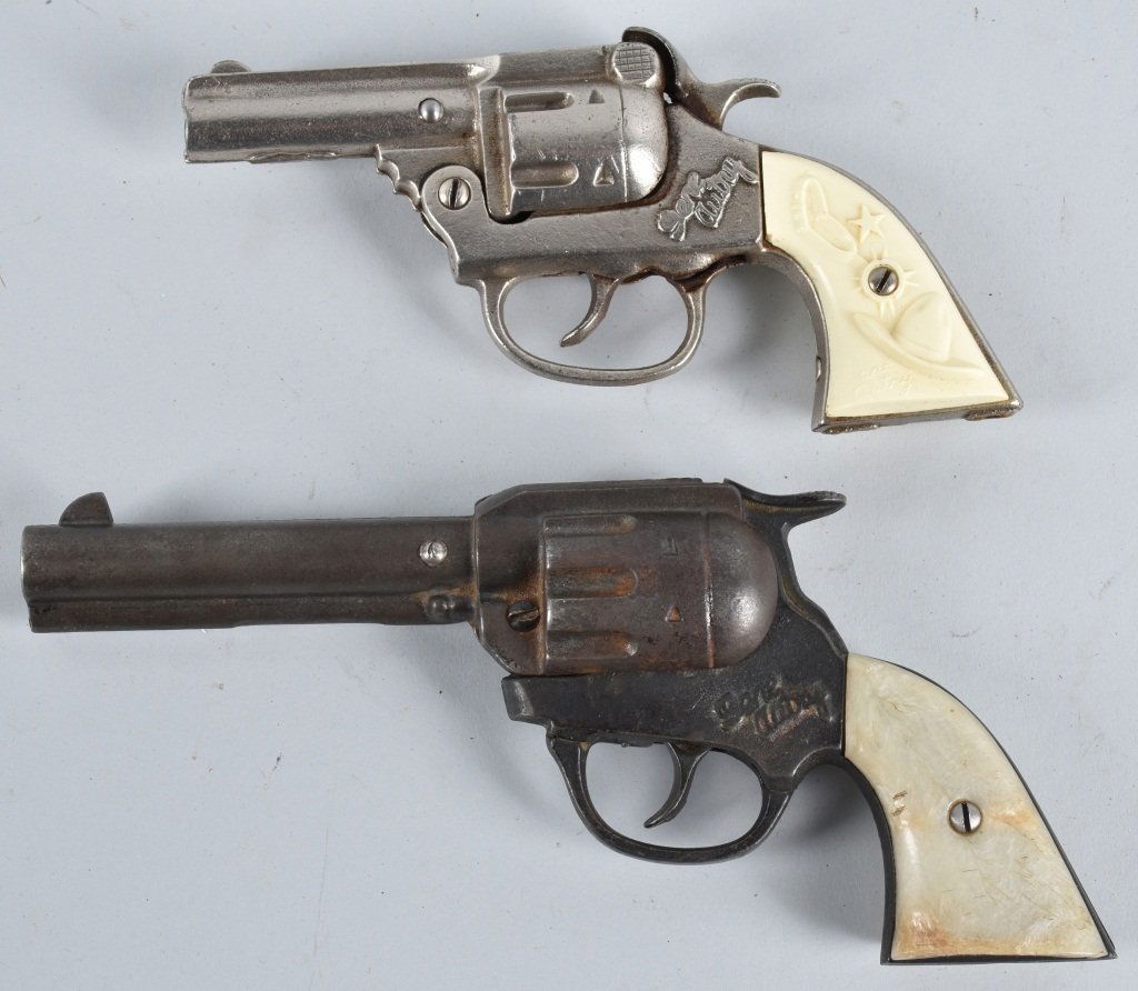 2-CAST IRON GENE AUTRY CAP GUNS: Largest is 8", both worked when tested. Very Good