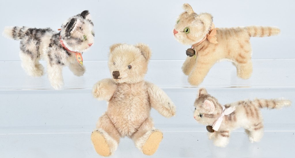 4-VINTAGE STEIFF ANIMALS: 1950's-60's lot includes Tapsy, Tabby and Kitty with paper labels. The Kitty is jointed. Also includes a bear with no IDs. Largest is 6 1/2". Excellent