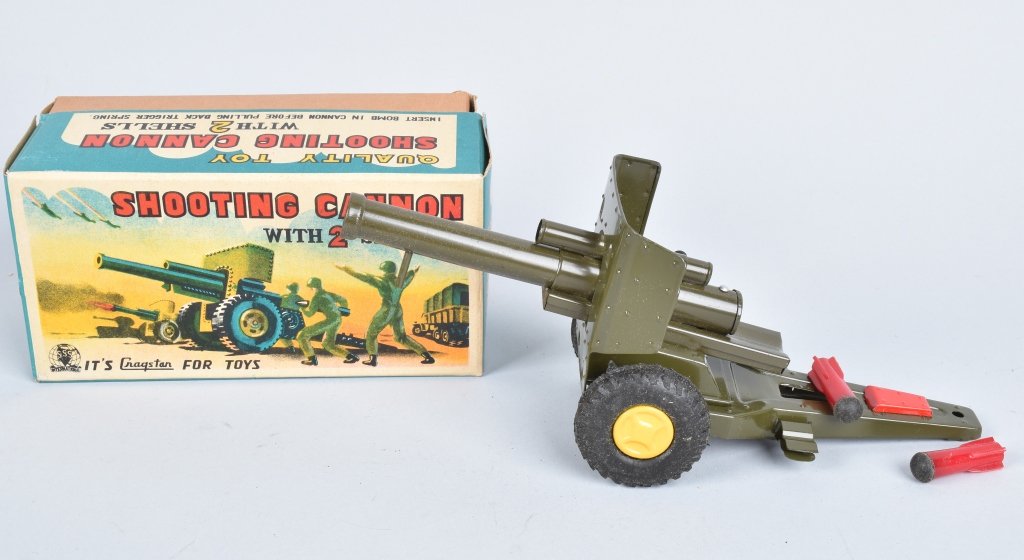JAPAN TIN SHOOTING CANNON w/ 2 SHELLS MIB: New Old Stock never played with. 7 1/2" Near Mint