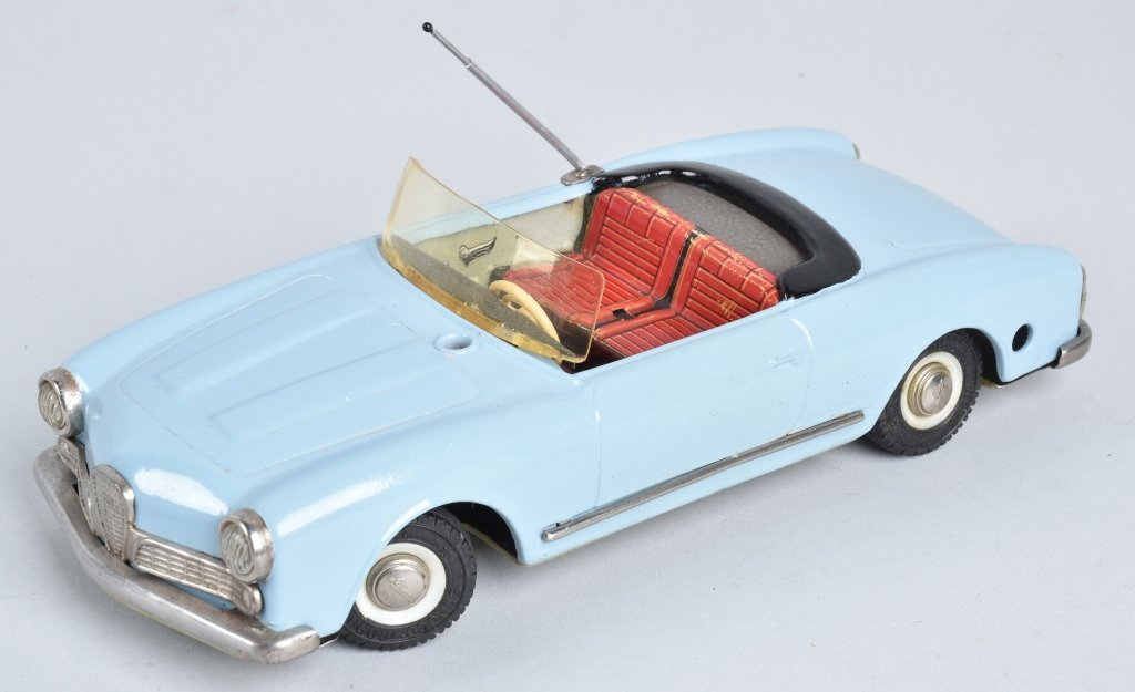 SCHUCO WINDUP MAGICO 2010 CAR: Schuco 2010 Magico Car. Works. Has been repainted. 9 1/2" Excellent