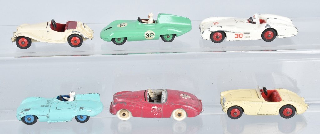 6 ENGLISH ISSUE DINKY RACE CARS: 6 English issue d/inky /Race cars to include Sunbeam alpine, Connaught, Jaguar D type, MG Midget, Austin Healey, and Mercedes Benz. Varying conditions as seen