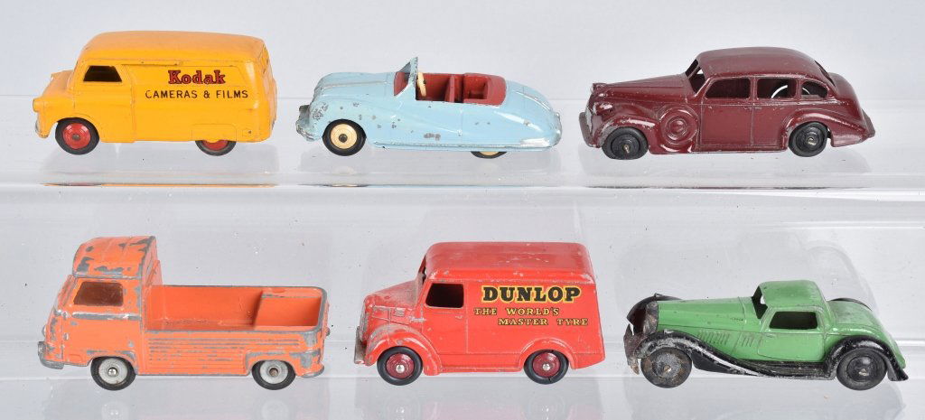 6 ENGLISH & FRENCH ISSUE DINKY CARS: 6 English & French issue dinky cars to include French issue # 563 Renault Pick Up, English issue Dunlop Tires Trojan delivery van, Kodak Bedford delivery van, Austin Atlantic, Buick, and green car. Va