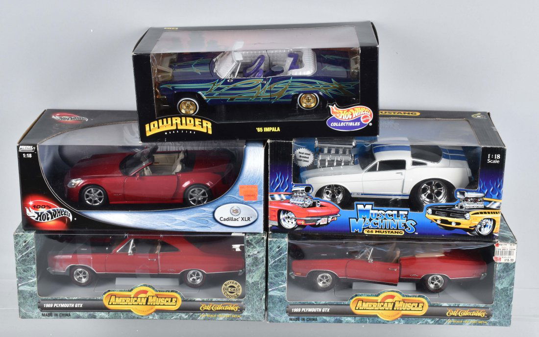 5 1/18TH SCALE ERTL HOT WHEELS MUSCLE MACHINE CARS: 5 1/18th Scale Die cast cars to include Ertl1969 Plymouth GTX hardtop & Convertable, Muscle Machine 66 Mustang, and Hot Wheels Cadillac XLR, and 65 Impala. All cars mint in mint boxes