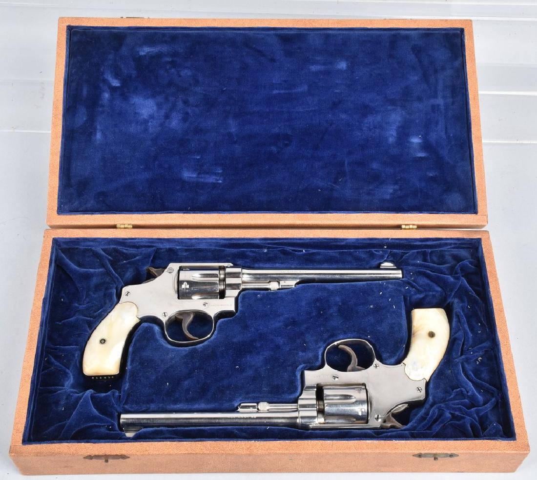 2-SMITH and WESSON .32 HE REVOLVERS: SN 522416 and 522418, both have 6'" barrels with excellent bores, both have nice action and nickel plating, markings are sharp, mother of pearl grips are excellent. Included is a form fitted display b