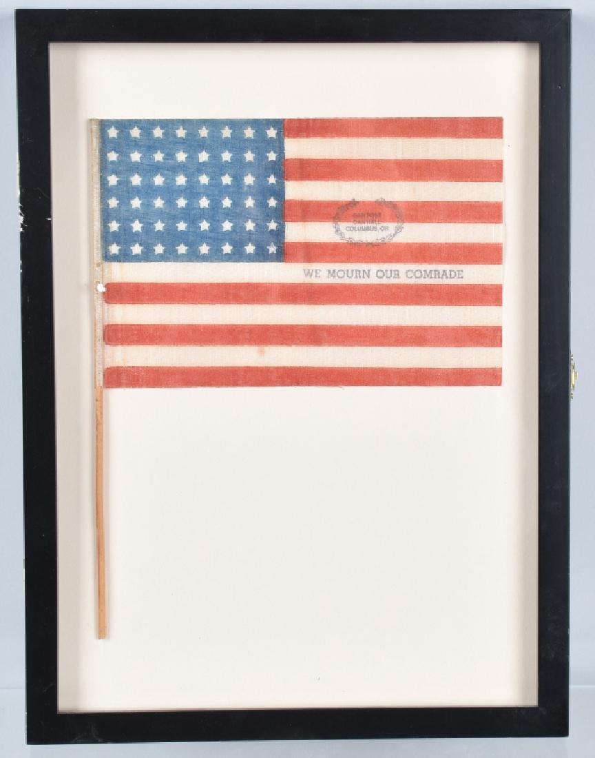 GAR 48 STAR PARADE FLAG, COLUMBUS, OHIO, FRAMED: 9" by 6" flag 48 star GAR flag, stenciled GAR Post Dan Hall Columbus, Ohio and We Mourn Our Comrade. Nicely matted and framed. Excellent