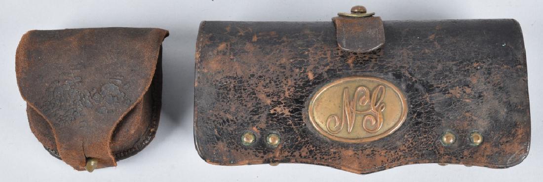CIVIL WAR CAP BOX and M1874 NG CARTRIDGE BOX: Cap box is in solid condition with overall wear, has vent pick, but is missing wool. Light makers mark on flap. The M1874 Mckeever cartridge box has wood block with holes for 18 45/70 cartridges. It i