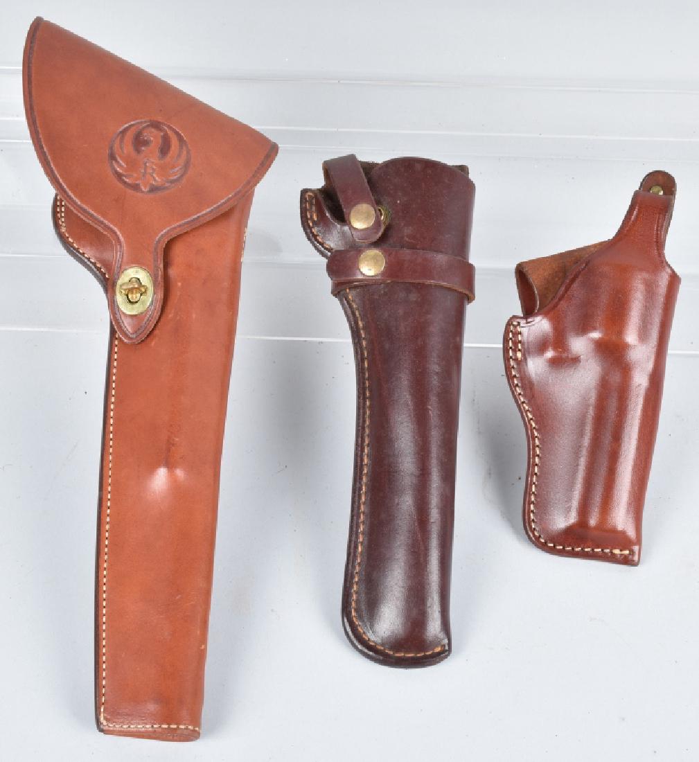 3-LEATHER PISTOL HOLSTERS, RUGER & MORE: Nice lot with a Bianchi 15" Ruger flap holster, along with 2 triple K holsters. Light wear. Excellent
