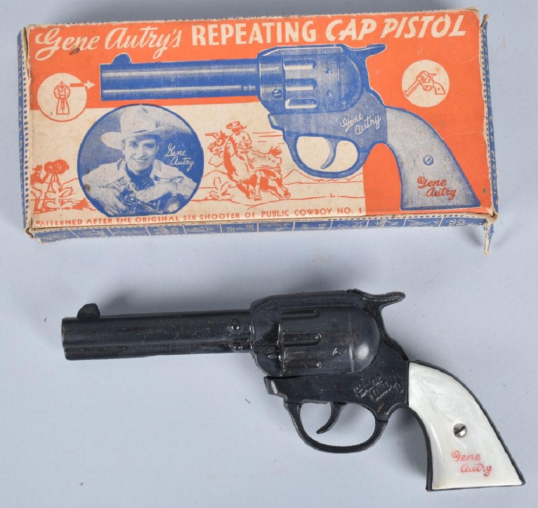 KENTON CAST IRON GENE AUTRY CAP GUN, BOXED: Great looking cap gun that appears unused. Works well. Includes colorful original box. Excellent