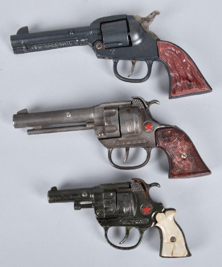 3-CAST IRON CAP GUNS, KENTON and HUBLEY: Nice group of early cast iron cap pistols all in working condition. Included is a Kenton Big Horn, Hubley Cowboy and Hubley Patrol. Very Good