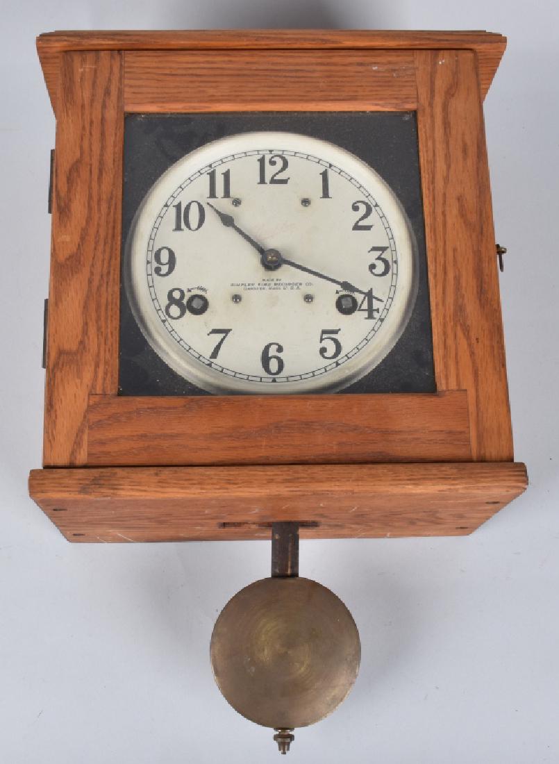 OAK SIMPLEX TIME RECORDER WALL CLOCK: 14 1/2" by 13" by 7", heavy well made oak wall clock. Has been over wound, but did work for while when tested. Includes key. Light wear. Excellent
