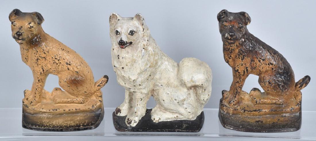 3-1930 DOG CAST IRON DOORSTOPS: Largest is about 8" high, and dated 1930 on reverse. general wear and loss. Good-Very Good