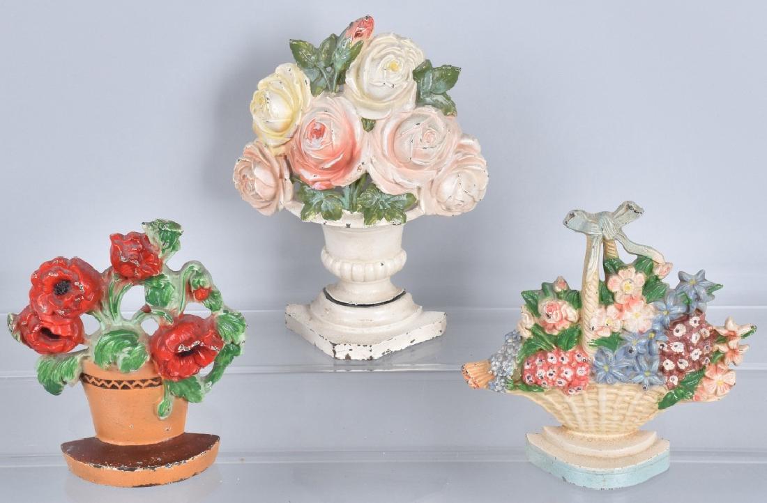 3-BASKETS of FLOWERS CAST IRON DOORSTOPS: Largest is 9", nice colors and details. Light wear and loss. Excellent