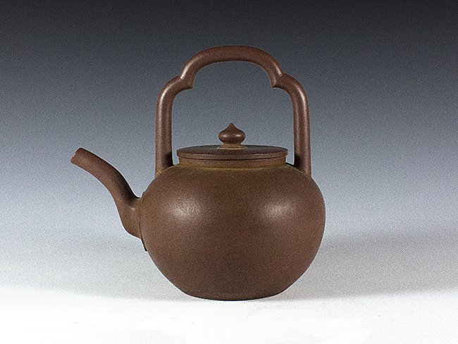 A Yixing brown clay teapot: 宜興紫砂壺 / 邵生祥製款 Seal incised "Shao Shengxiang" 6 3/4in. (17.2cm.) H