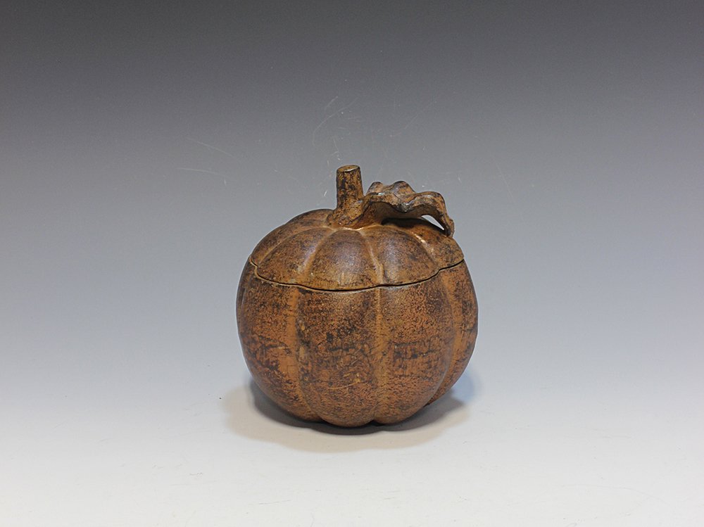 Iron box: 鐵盒 In the shape of pumpkin. 4.5in. (11.5cm.)H