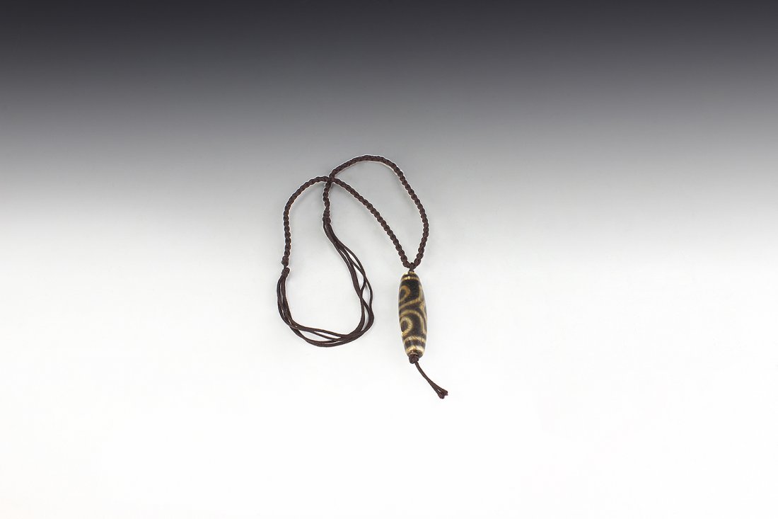 A three-eye Dzi bead (1 of 1)