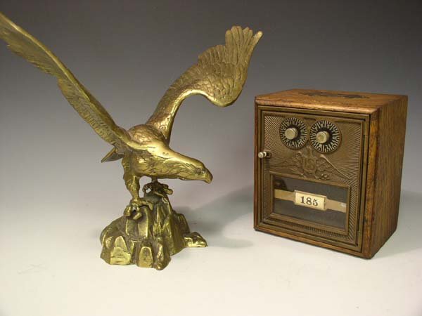 Large Brass Eagle Sculpture and Post Box: You are bidding on a Large Brass Eagle Standing 12" Tall by 15" At widest point. Also an Antiques post office box made into a coin bank by Oddysey Co. David Iver Auctions will be conducting this onlin