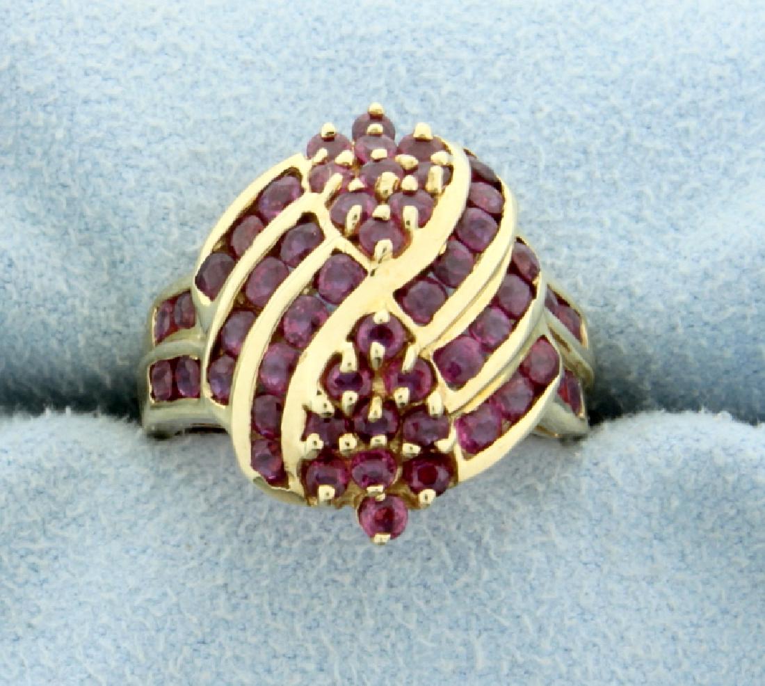 1 1/2ct Total Weight Lab Ruby Ring: In 10K yellow gold, it contains fifty two 2mm round lab ruby gemstones with great red color. Size 6 1/4 4.4g