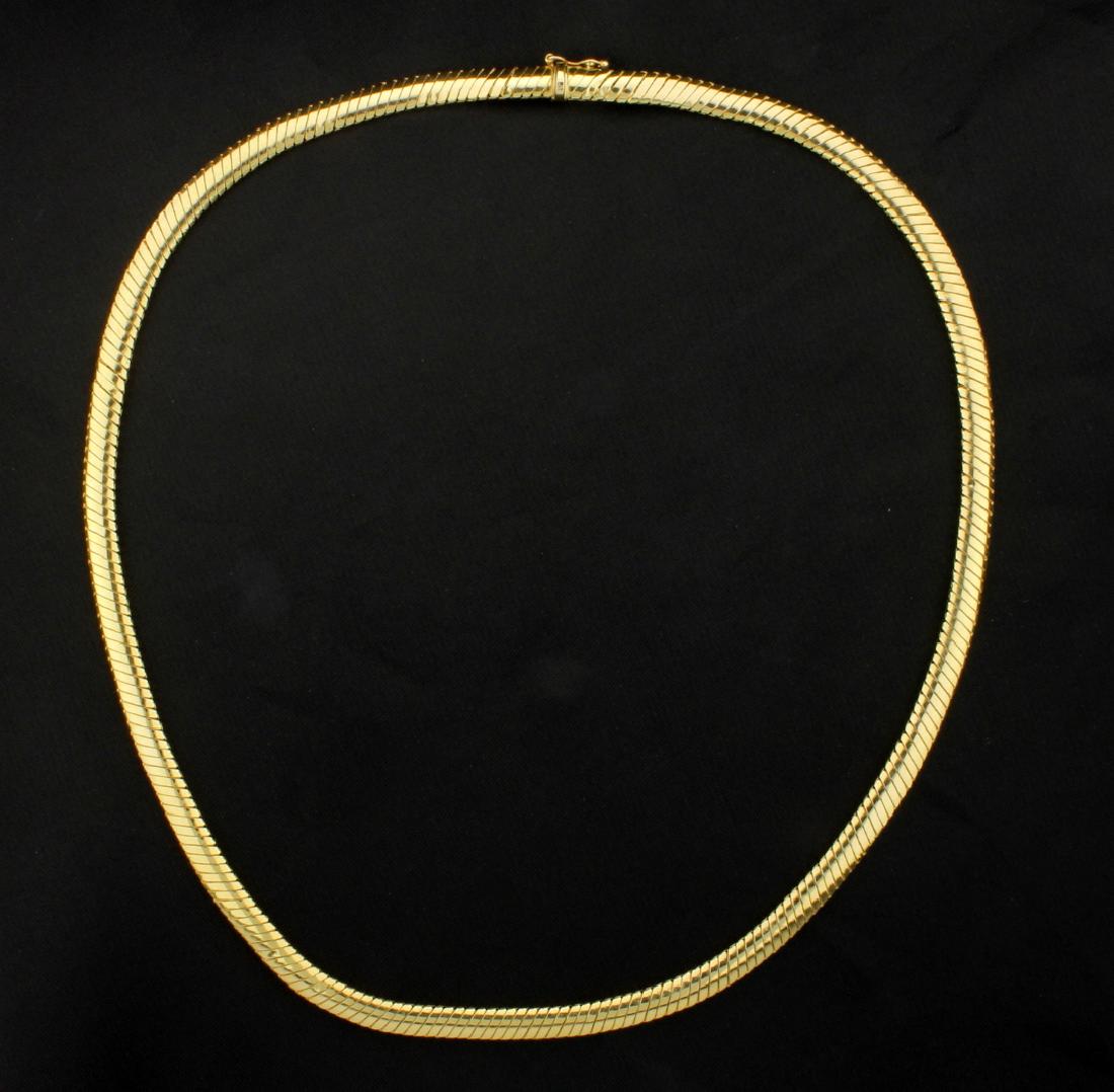 18 Inch Omega Style Necklace: 14K yellow gold, it is 5mm wide and has a safety clasp. 14.0g