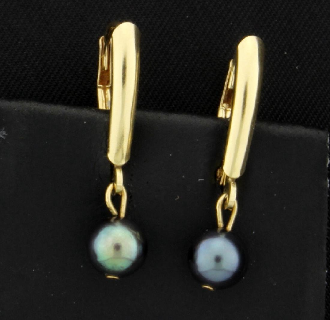 Tahitian Pearl Dangle Earrings: In 14k yellow gold these earrings are 1inch long. Each earring contains 5.5mm pearl. 1.3g